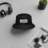 White Robbie bucket hat flat lay mockup